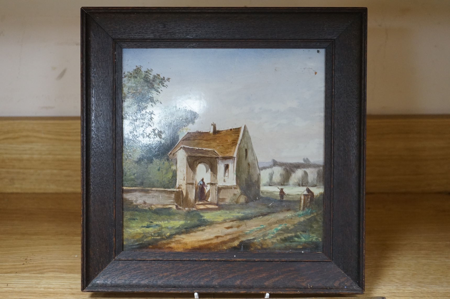 Four ceramic painted plaques depicting landscapes to include ‘Upper Lake Killard’, three framed, largest 36cm wide